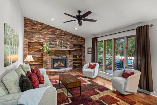 main floor family room with a wall of windows for great natural light overlooking back deck/yard