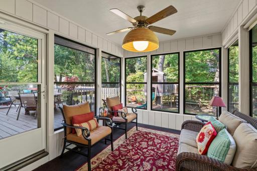 3 season porch off back deck overlooking backyard