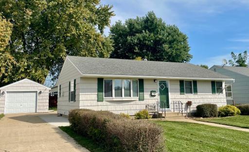 Front of home, newly painted house and garage