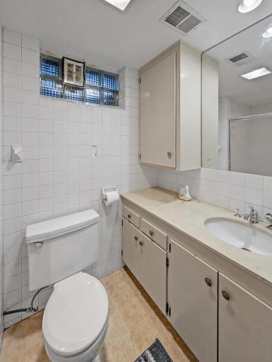 Basement 3/4 bath with lots of storage space!