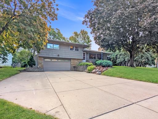 Tuckunder garage with ample driveway space for extra parking!