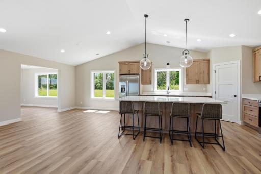 Vaulted ceilings and an open floorplan enhance the sense of space, comfort, and functionality.