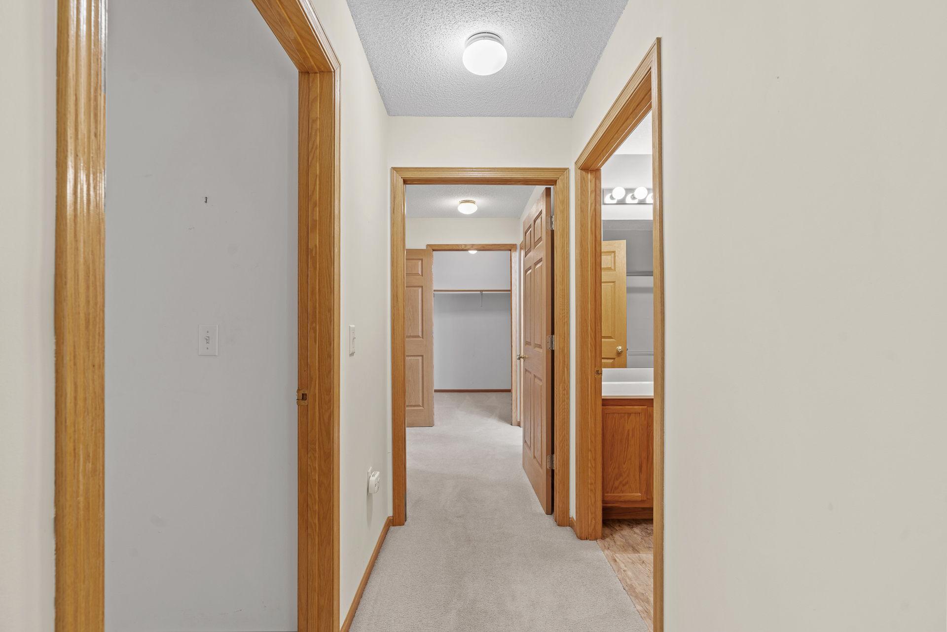 Hallway to bathroom and bedroom