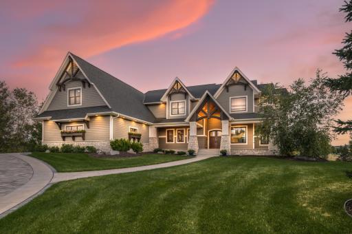 Set high on a hill in a private Lake Elmo neighborhood, this extraordinary custom-built estate spans nearly 10,000 finished square feet and offers six bedrooms, seven bathrooms, and an elevator that services every level.