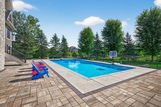 The fully fenced backyard is anchored by a 44-by-20-foot in-ground pool.