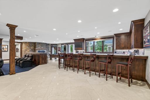 The lower level is an entertainerâs paradise with heated floors throughout. It begins with a showstopping wet bar, complete with Brazilian granite and a two-tier peninsula.