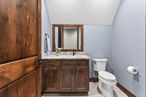 The adjoining half bath adds thoughtful convenience for guests or daily use.