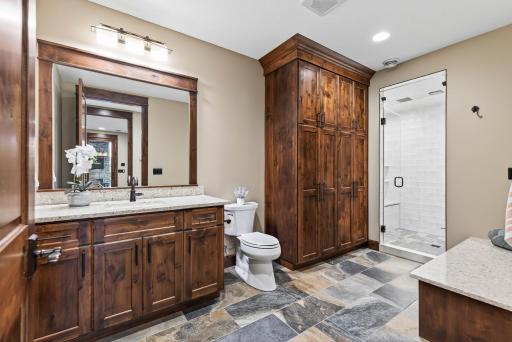Tile flooring, built-in cabinetry, and built-in bench seating ensure plenty of function and storage in this space.