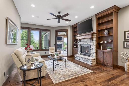 A standout feature of the property is the private mother-in-law suite, designed as a complete residence of its own. It enjoys a private entrance, front patio, and a heated single-car garage, ensuring both comfort and independence.