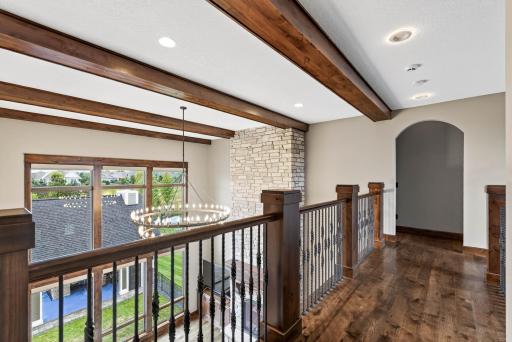 The upper level offers three additional bedrooms, each with its own character and thoughtful design.