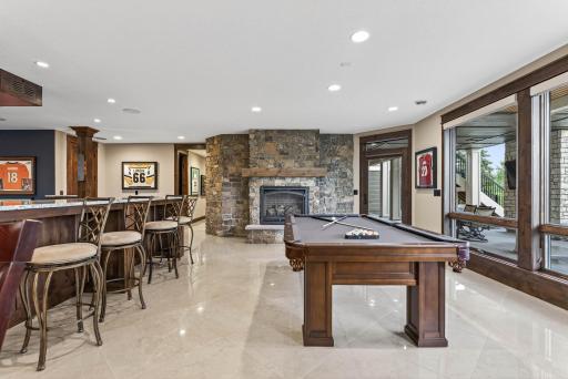 With walkout access to the patio, the living area extends seamlessly outdoors for effortless indoor-outdoor enjoyment.
