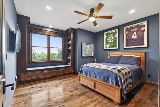 One bedroom features a built-in window bench with cabinetry and a desk area, creating the perfect blend of comfort and functionality.