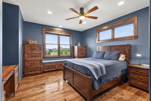 The second bedroom also enjoys built-in window seating, dressers, and a walk-in closet for plenty of organization.