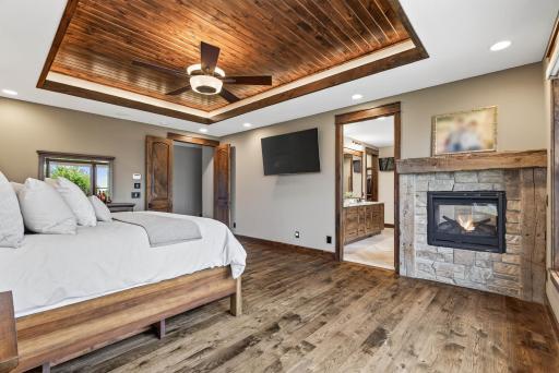 A double-sided fireplace warms both the bedroom and the ensuite.
