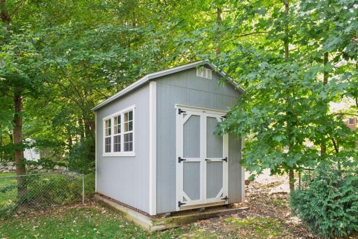 In addition to the 3-car heated garage, there's also this handy storage shed for your gear.