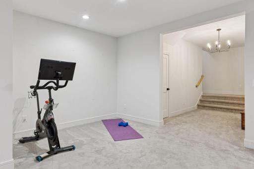 Flexible layout can function as a home gym space, videogaming area, office nook, and more.