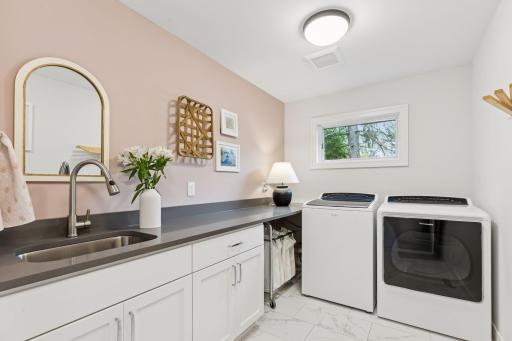 This upper level laundry is bright and sunny and full of storage space.