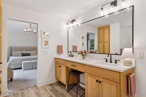 Custom white oak vanities with dual sinks. Hidden outlets for electric toothbrushes and hair styling tools, high-end steam shower with 2-person programmable thermostat. Oversized soaking tub. Move right in and enjoy!