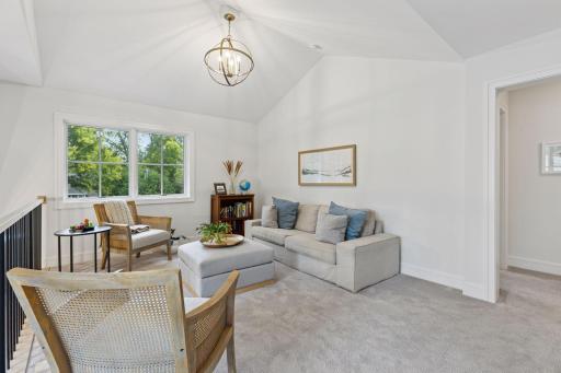 Upstairs, you'll find a sunny loft space. The blueprints for the home (available) also allow for this space to be walled-off, should you need an additional upper level bedroom in the future.