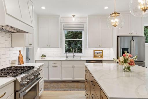 Custom cabinetry throughout, with endless storage. A commercial grade 6 burner gas range is perfect for the family chef.