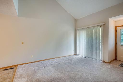 4891 Helena Ln N unit 4-Living room w vaulted ceiling and patio door