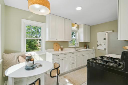 Dine-in kitchen with updated cabinets and quartz countertops