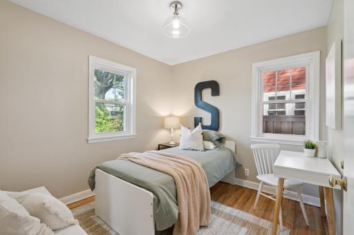 Second main floor bedroom with west-facing window overlooking the backyard