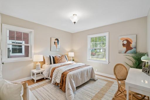 Main floor bedroom with refinished hardwood floors