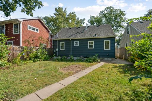 Backyard with patio and privacy fence on two sides
