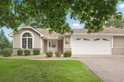 Welcome to this beautifully maintained twin home, tucked in the sought-after Pine Meadow neighborhood known for its charm, award-winning design, and rare availability.