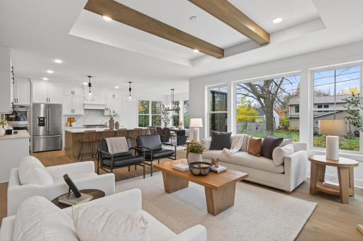 The open-concept main level, w/10-foot ceilings & expansive Andersen windows, bathes the home in natural light while showcasing on-site finished maple hardwood floors, custom cabinetry & exquisite tilework that speak to the finest in design & detail.