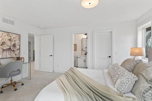This inviting upper level bedroom offers comfort and privacy with its own beautifully appointed three-quarter ensuite bathroom.