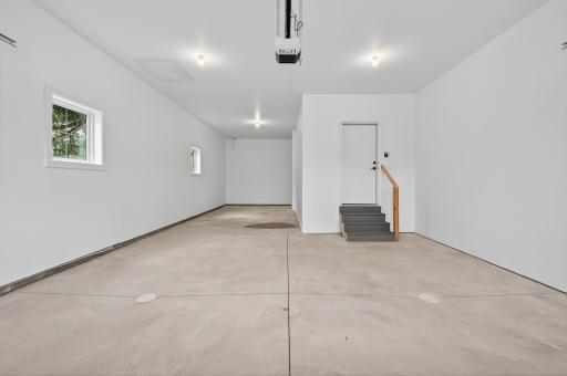 Completing this remarkable home is an expansive three-car heated and insulated garage, thoughtfully designed with a tandem stall to accommodate additional storage or a hobby area.