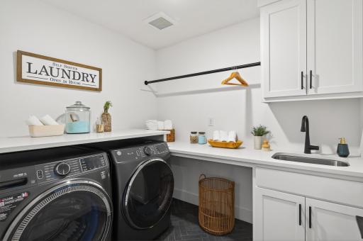 While the upper level sophisticated laundry room enhances everyday convenience.