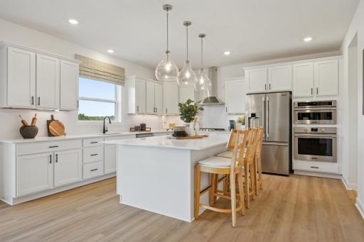 (Photo of model home, actual finishes will vary) The kitchen is equally stylish and practical with sleek cabinetry, high-end finishes and all-new stainless steel appliances.