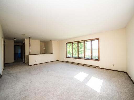 Walk up the stairs into the bright living room