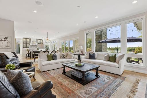 Family room opens up to dining area and kitchen. Large windows frames the views