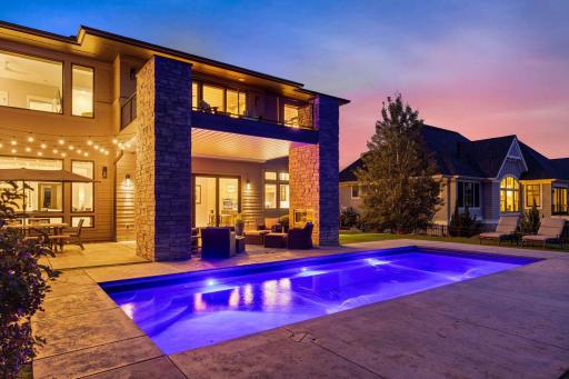 Night view of pool and patio
