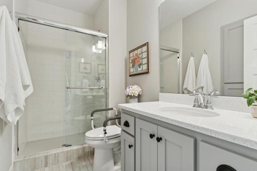 Lower level 3/4 bath with tile heated floors