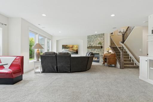 Natural light flows through the expansive lower level with heated floors