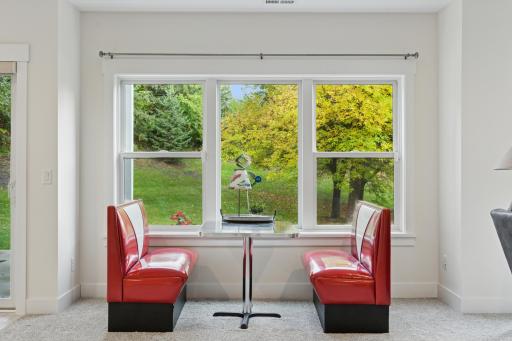 Game/Rec area is perfect for game tables and features a wall of built-in cabinetry and book/display shelves
