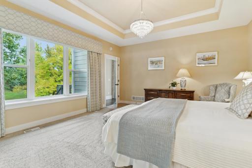 The primary suite offers a private 3/4 bath and large walk-in closet with custom organizers