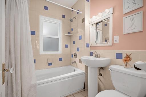 Vintage tile bath with colorful accents