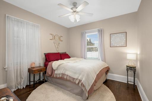 Bedrooms feature hardwood floors and neutral tones