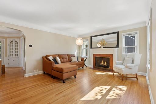Beautiful hardwood flooring, wonderful natural light and a cozy wood burning fireplace.