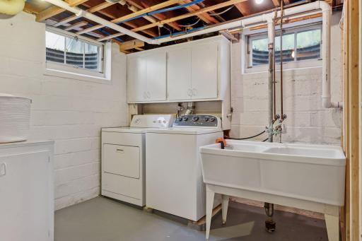 Proper Laundry Room w/ door & utility sink (water softener to left - not shown)