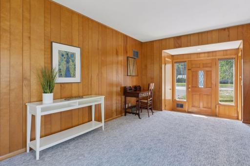 Separate Mudroom entrance with a coat closet (left side) and entrance to the lower level (right side)