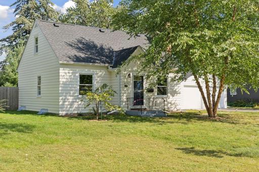 Sweet 1.5 story home with a Newer Roof (2025) and a welcoming front entrance.