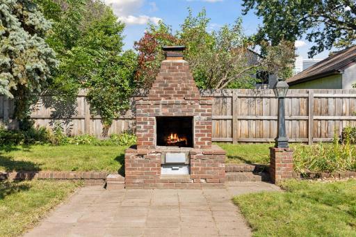 Charming light post and brick outdoor fireplace (works fine - however, brick needs a lil TLC)