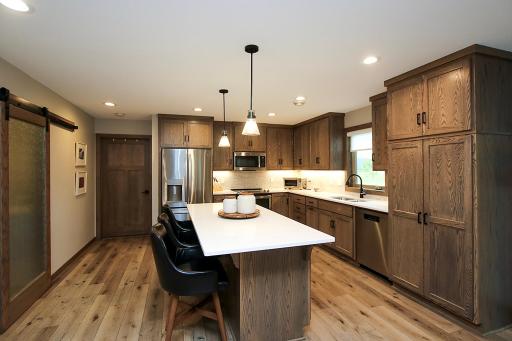 Under cabinet lighting accentuates the beautiful backsplash!